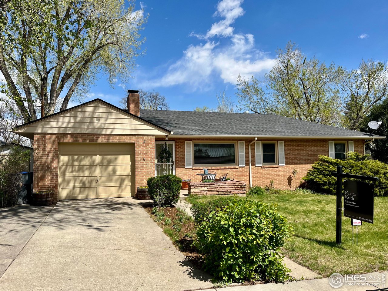 6 Sunset Circle Longmont, CO 80501 - Photo 1 of 37 a front view of a house with garden