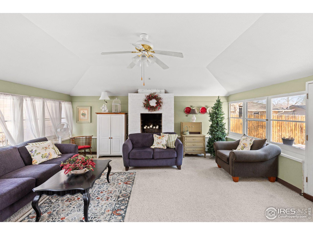 6 Sunset Circle Longmont, CO 80501 - Photo 14 of 37 a living room with furniture and a fireplace
