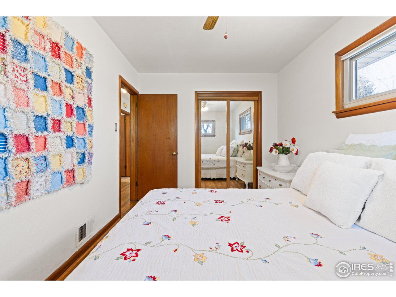 6 Sunset Circle Longmont, CO 80501 - Photo 17 of 37 a picture of a bedroom with a bed and a dresser