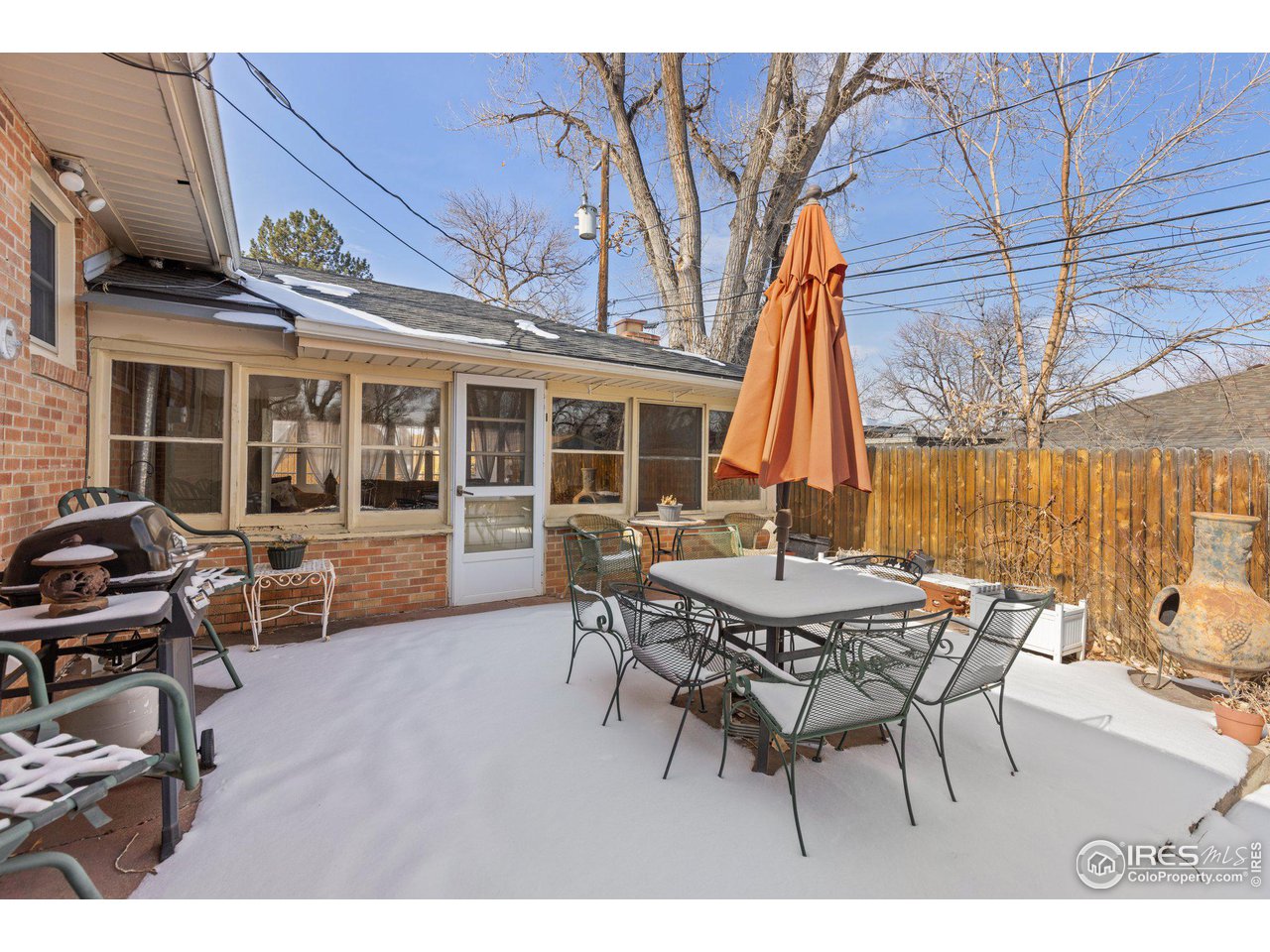 6 Sunset Circle Longmont, CO 80501 - Photo 21 of 37 a view of a dinning table and chairs in the patio