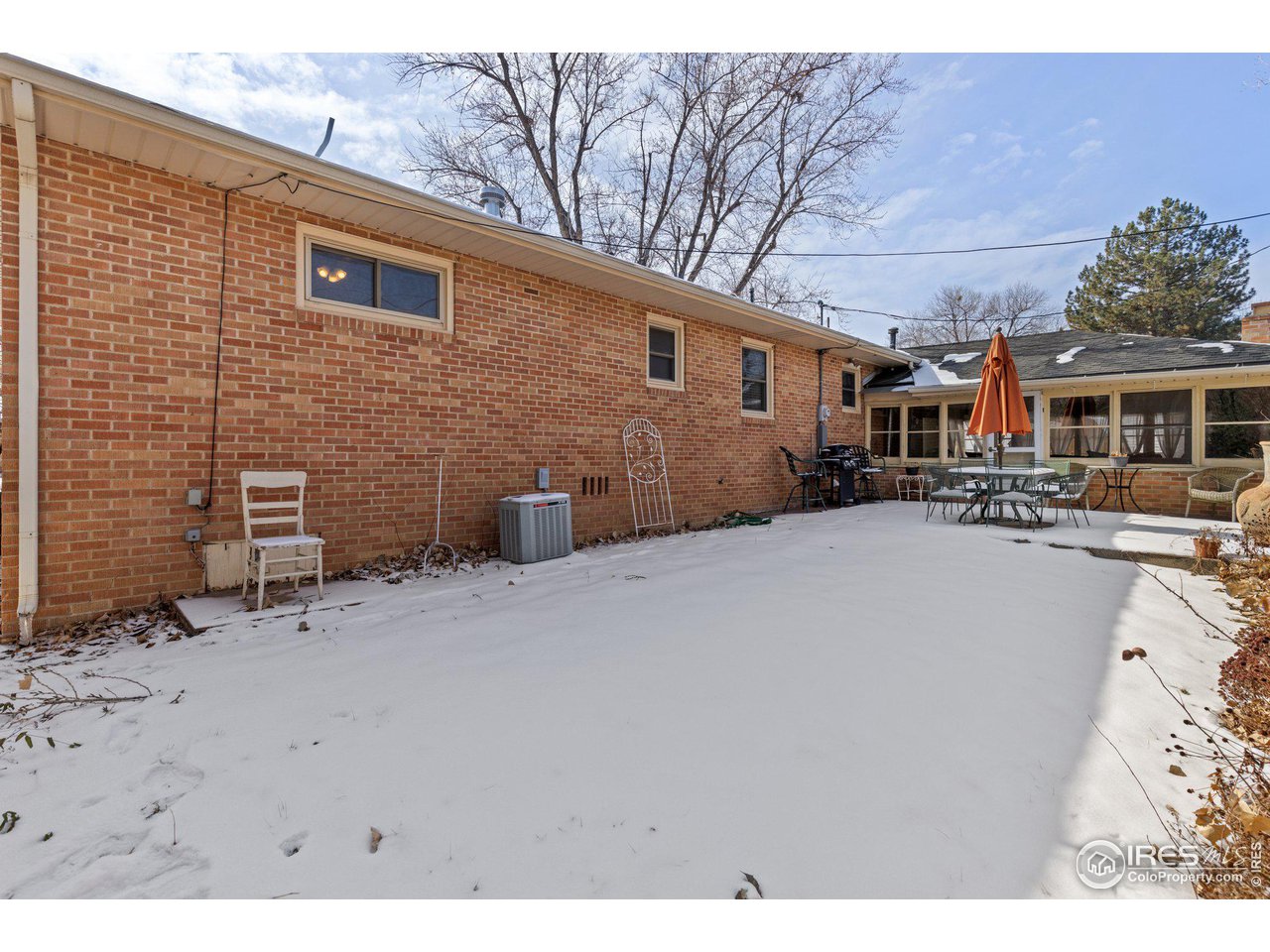 6 Sunset Circle Longmont, CO 80501 - Photo 23 of 37 a backyard of a house with fire pit and trees