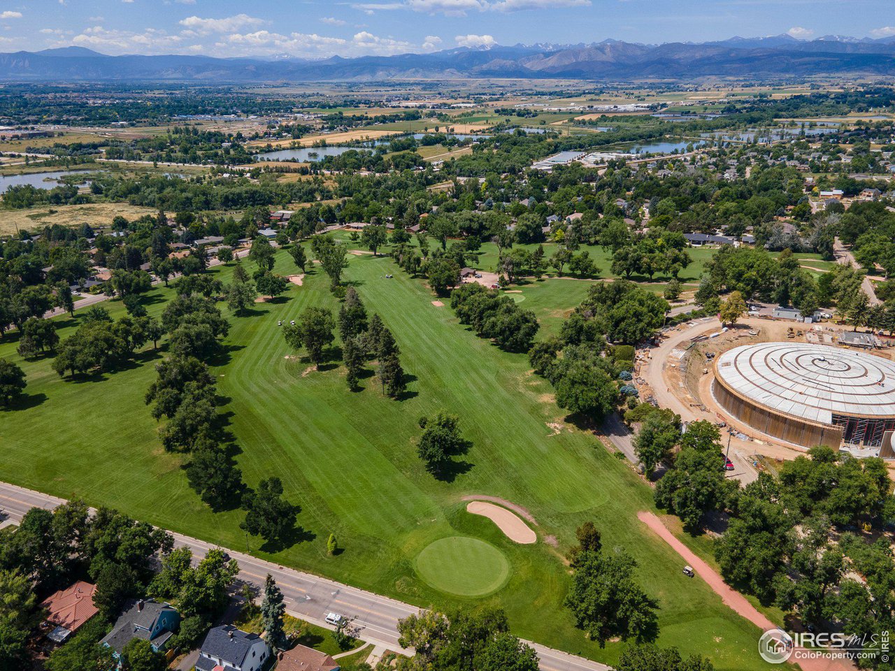 6 Sunset Circle Longmont, CO 80501 - Photo 27 of 37 an aerial view of a city and mountain view in back
