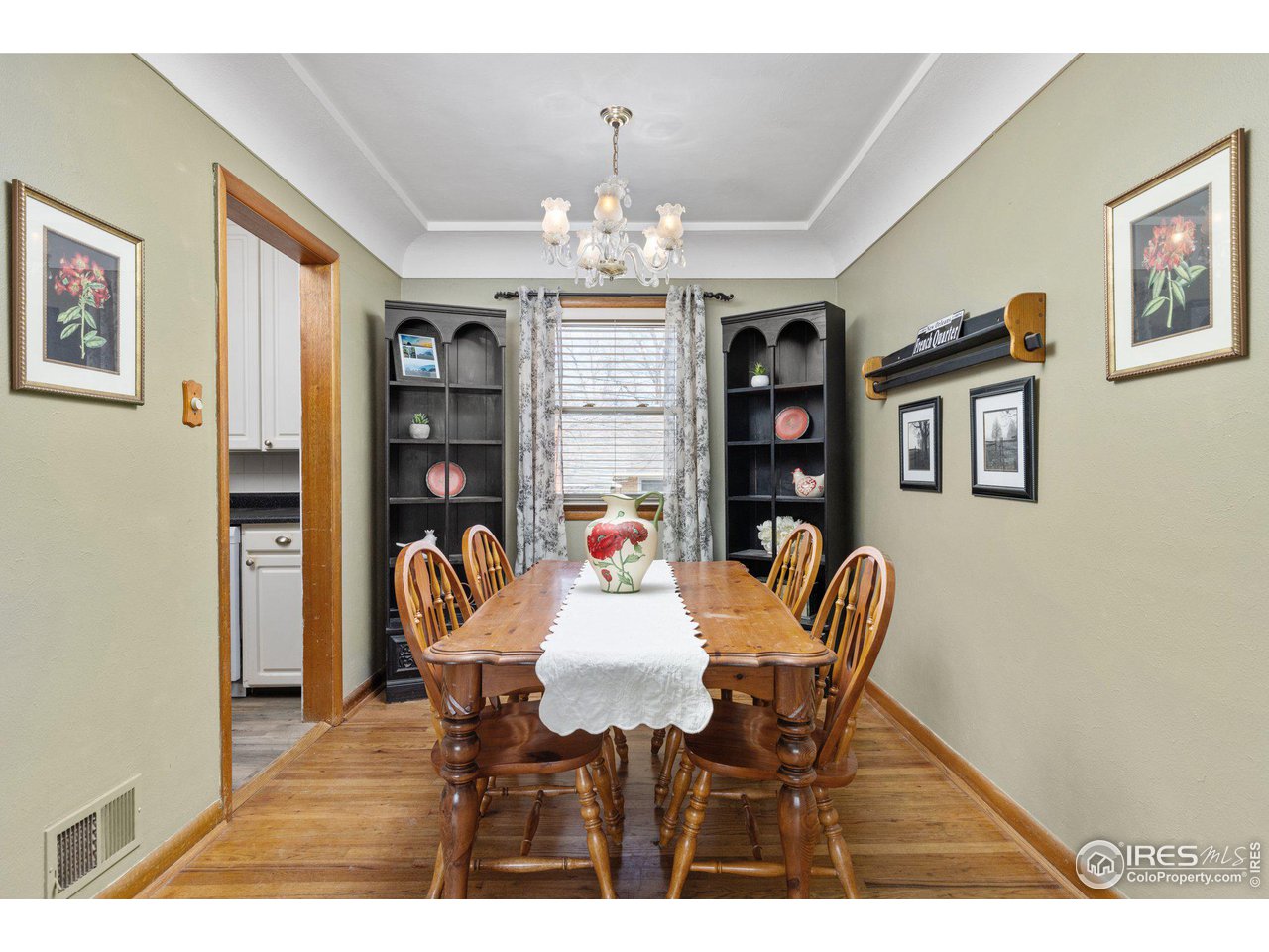 6 Sunset Circle Longmont, CO 80501 - Photo 10 of 37 a dining room with furniture and chandelier