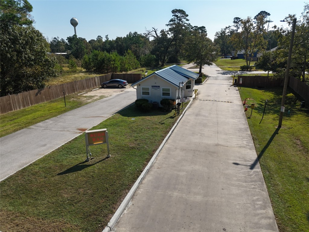 445 Carolcrest Lane, Unit 112 Livingston, TX 77351 - Photo 26 of 33 a view of a street with houses on both side