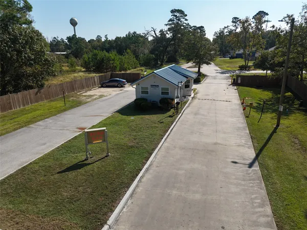 a view of a lake with a yard