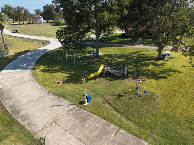 a view of a swimming pool with lawn chairs