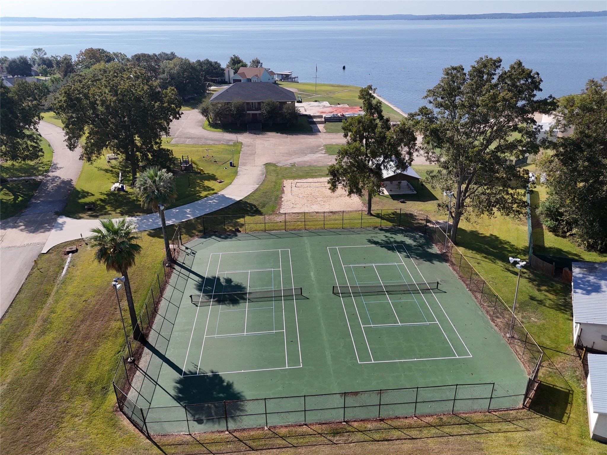 445 Carolcrest Lane, Unit 112 Livingston, TX 77351 - Photo 32 of 33 a view of a tennis court
