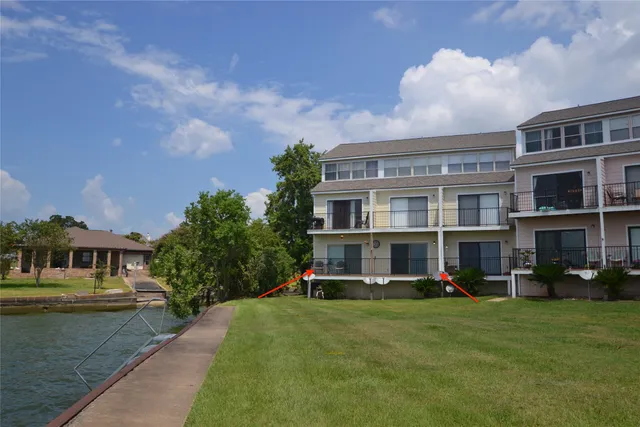 an aerial view of a house with a swimming pool