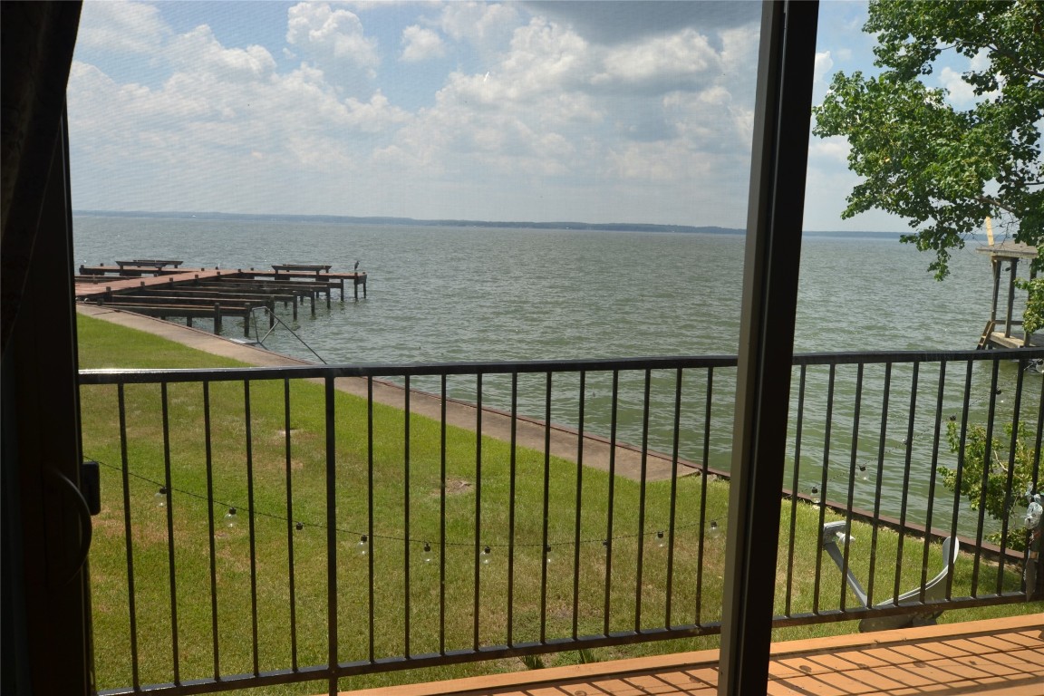 445 Carolcrest Lane, Unit 112 Livingston, TX 77351 - Photo 10 of 33 a view of a balcony next to a lake view
