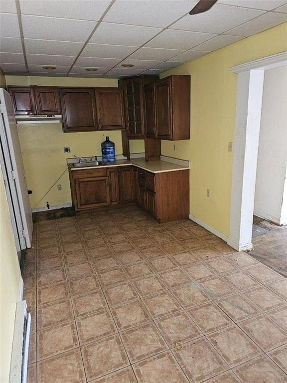 300 Longfellow Street Vandergrift, PA 15690 - Photo 12 of 34 a kitchen with a sink and wooden cabinets