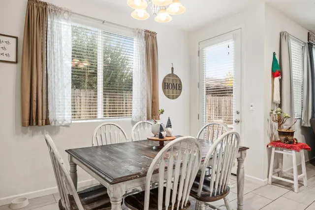 a view of a dining room with furniture and windows