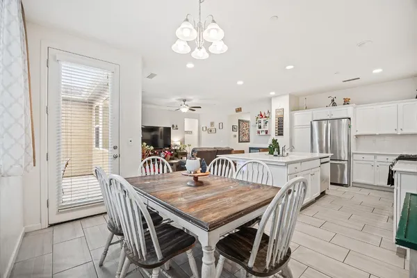 a dining room with furniture and window