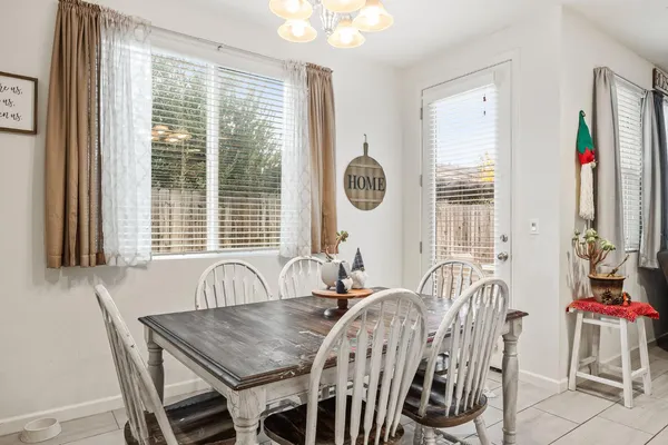 a view of a dining room with furniture and windows