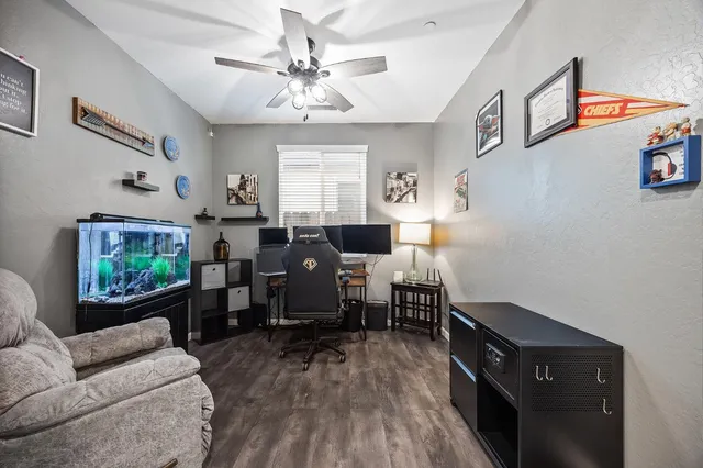 a living room with furniture and wooden floor