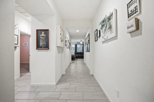 a view of a hallway with seating area