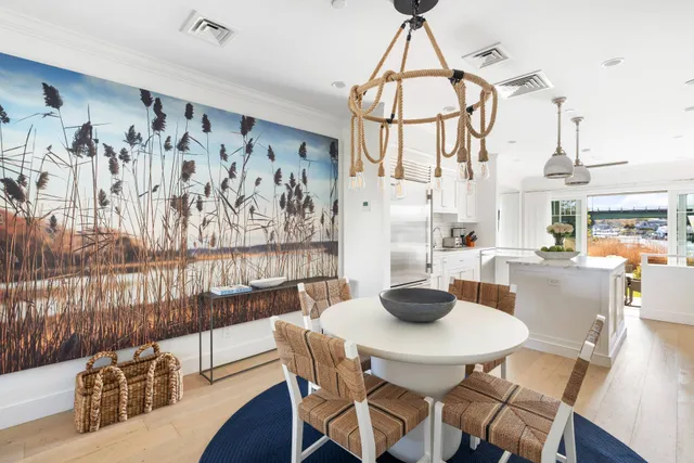 a dining room with furniture and wooden floor