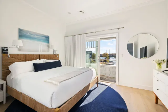 a large white bed in a white room