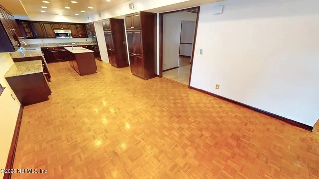 a view of an empty room with a fireplace