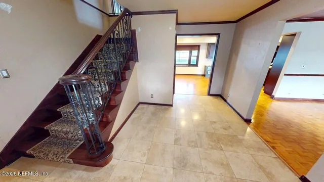 a kitchen with stainless steel appliances granite countertop a refrigerator a oven a sink with wooden cabinets