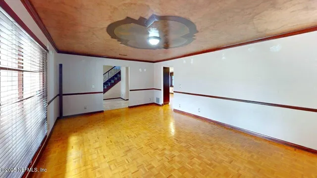 a view of an empty room with a window