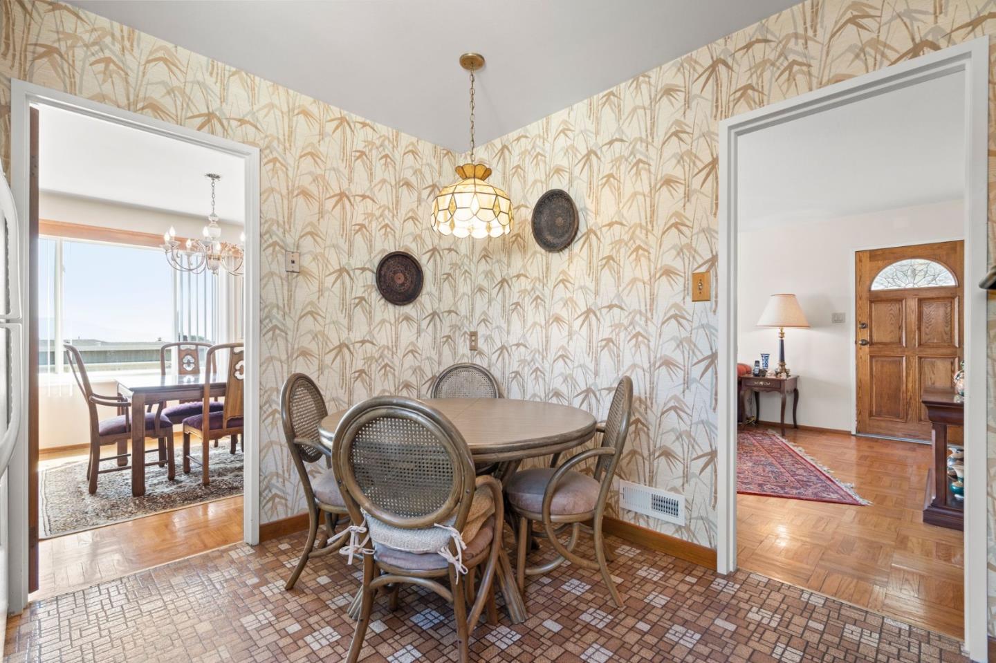 430 Higate Drive Daly City, CA 94015 - Photo 16 of 40 a view of a dining room with furniture and wooden floor