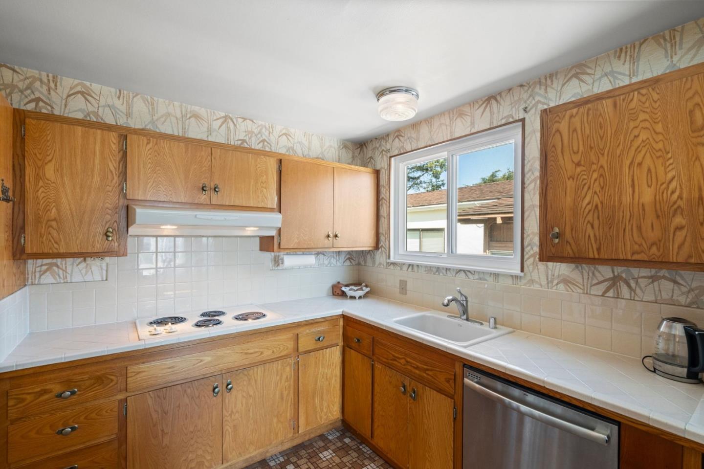 430 Higate Drive Daly City, CA 94015 - Photo 19 of 40 a kitchen with a sink cabinets and window