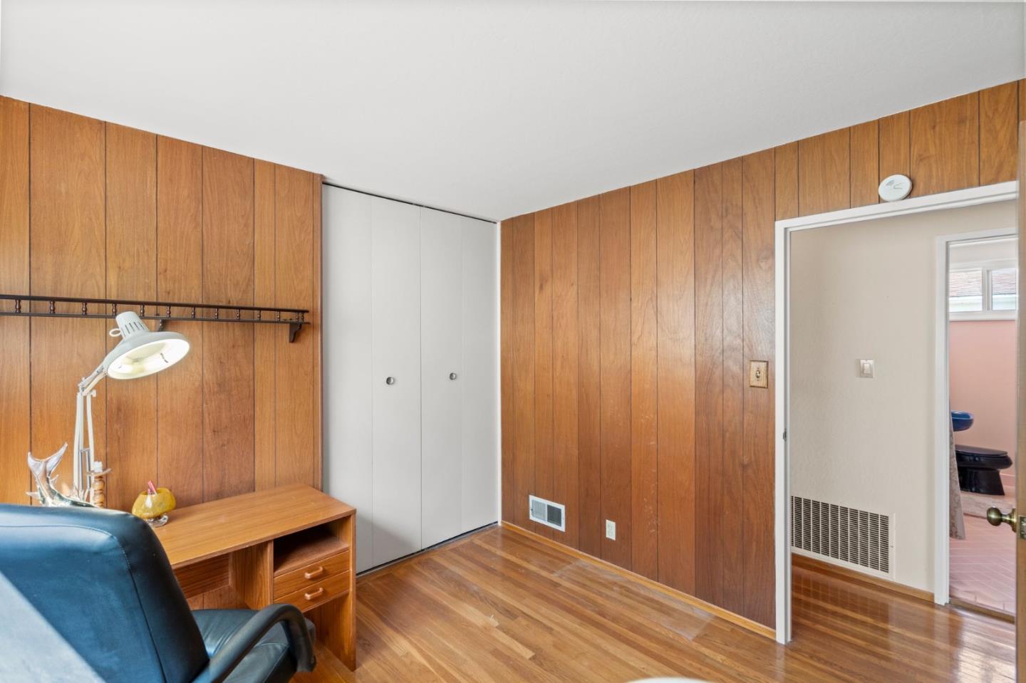 430 Higate Drive Daly City, CA 94015 - Photo 22 of 40 a view of a room with wooden floor and chair