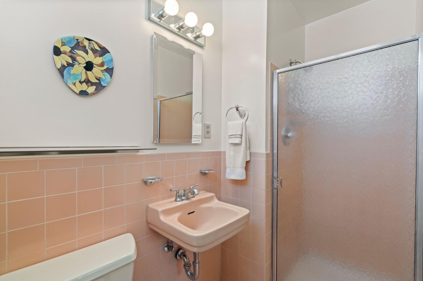 430 Higate Drive Daly City, CA 94015 - Photo 32 of 40 a bathroom with a sink a mirror and a shower