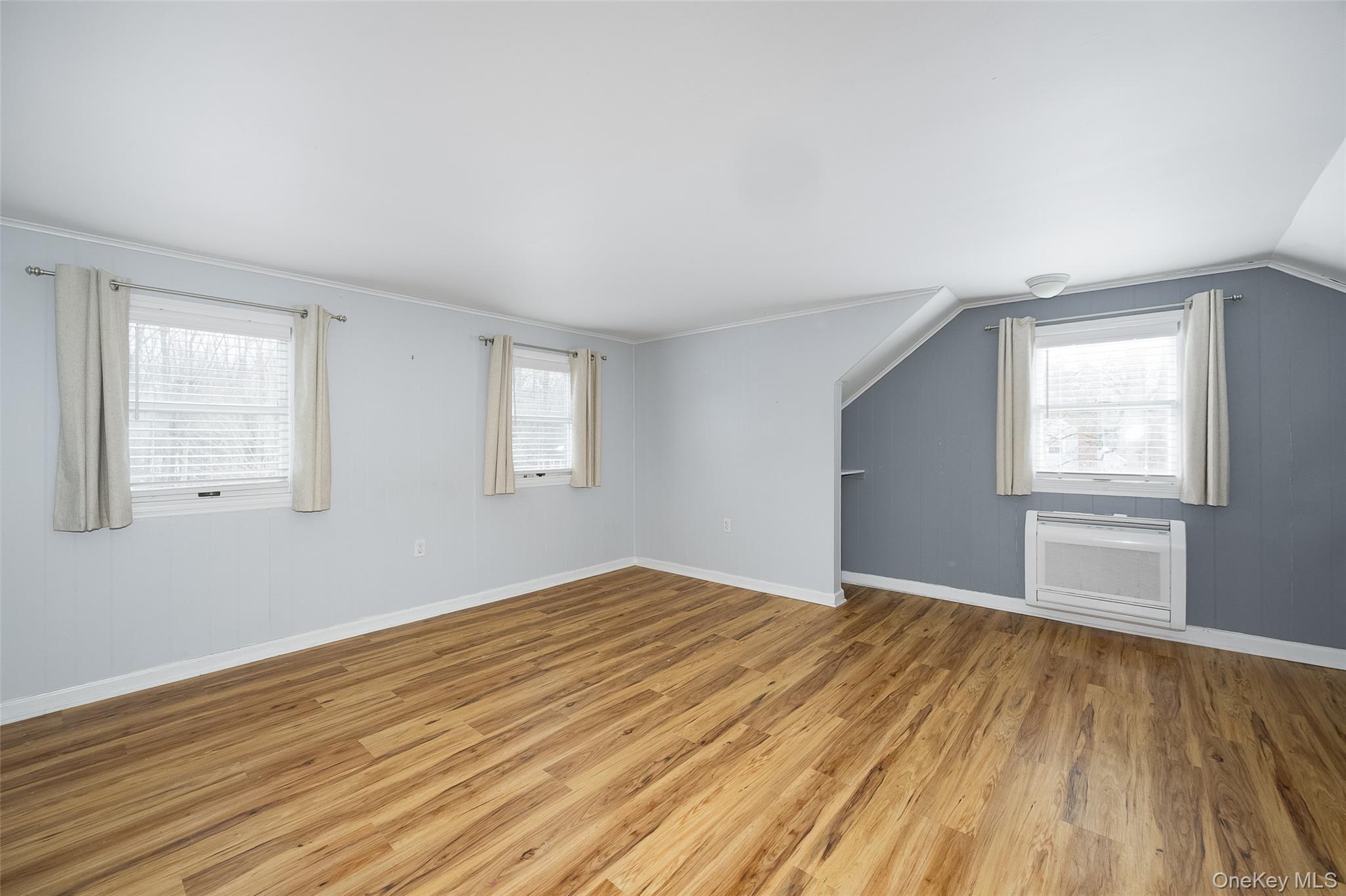 12 Valley View Road Hyde Park, NY 12538 - Photo 15 of 31 a view of an empty room with wooden floor and a window