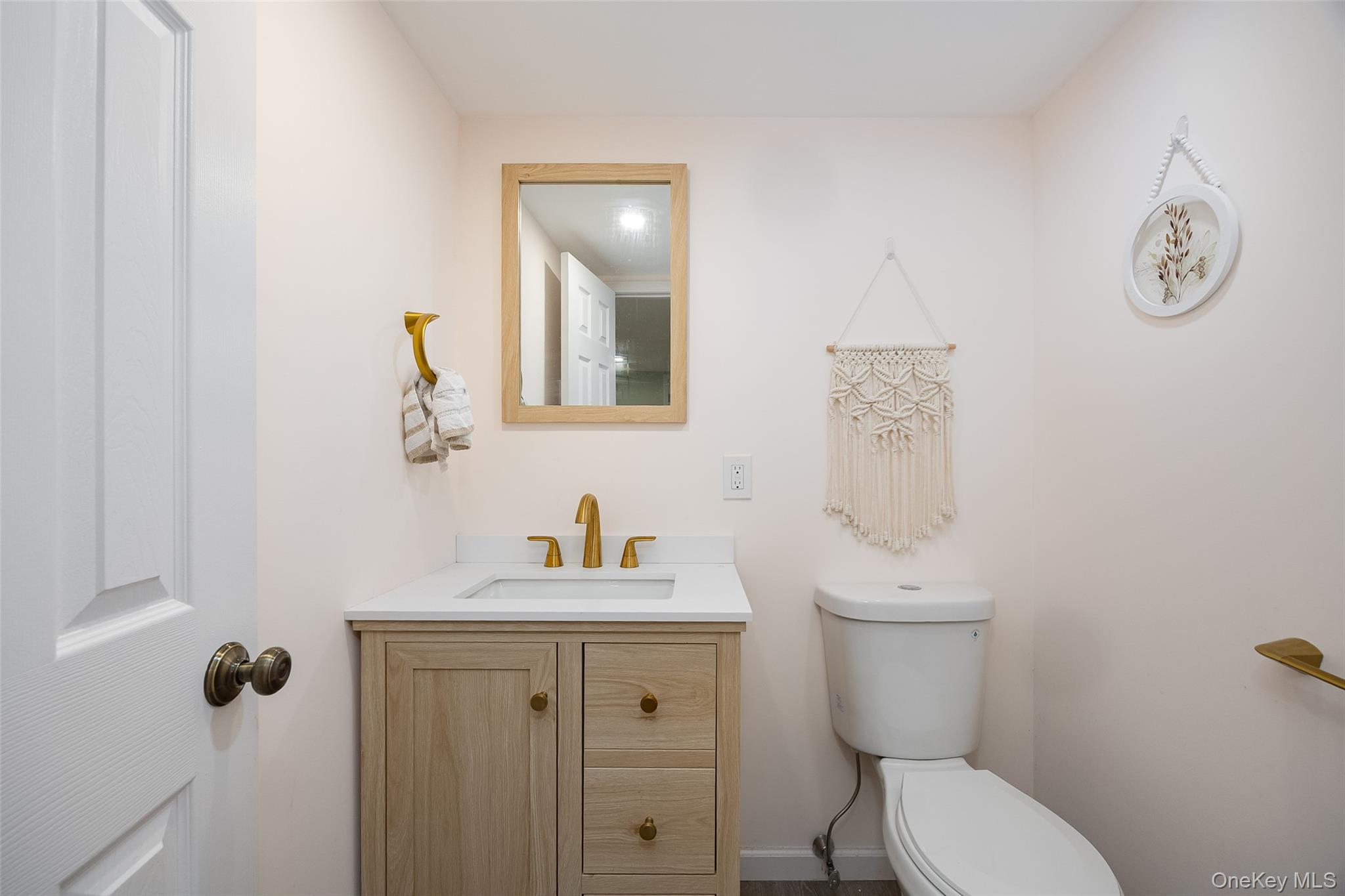 12 Valley View Road Hyde Park, NY 12538 - Photo 23 of 31 a bathroom with a toilet sink vanity and mirror