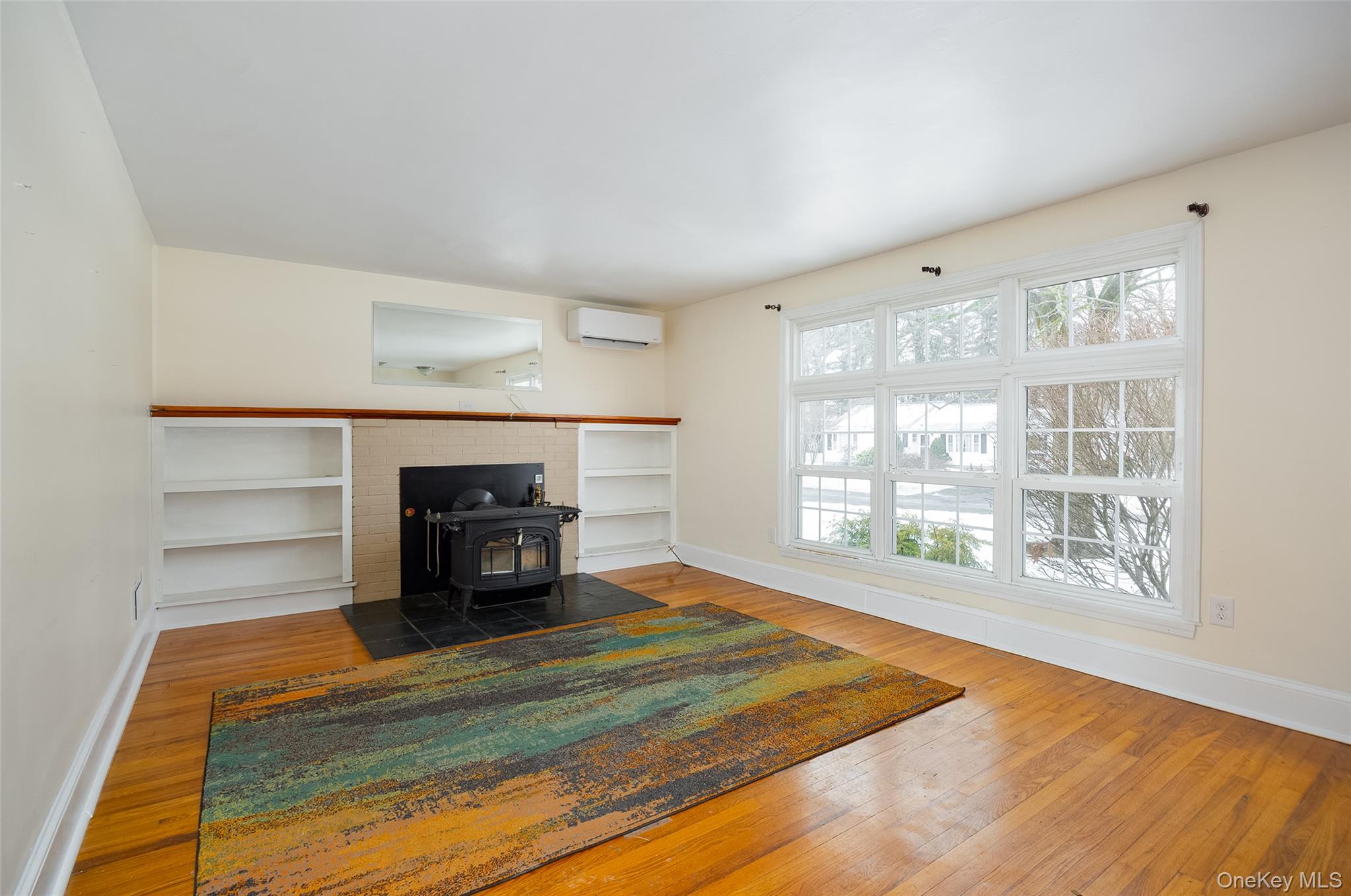 12 Valley View Road Hyde Park, NY 12538 - Photo 4 of 31 a living room with hard wood floors and a fireplace