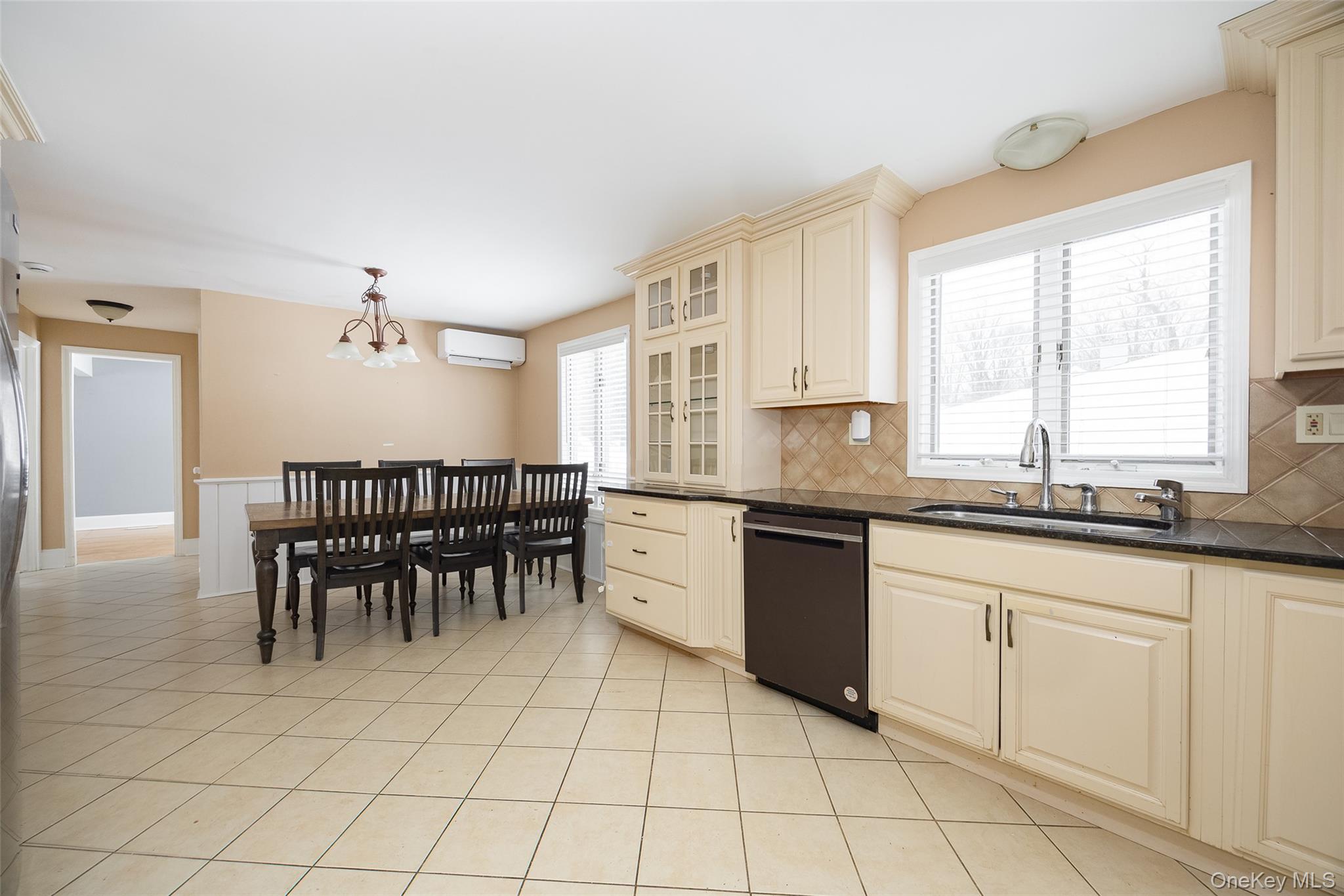 12 Valley View Road Hyde Park, NY 12538 - Photo 7 of 31 a large kitchen with white cabinets a sink a window and a counter