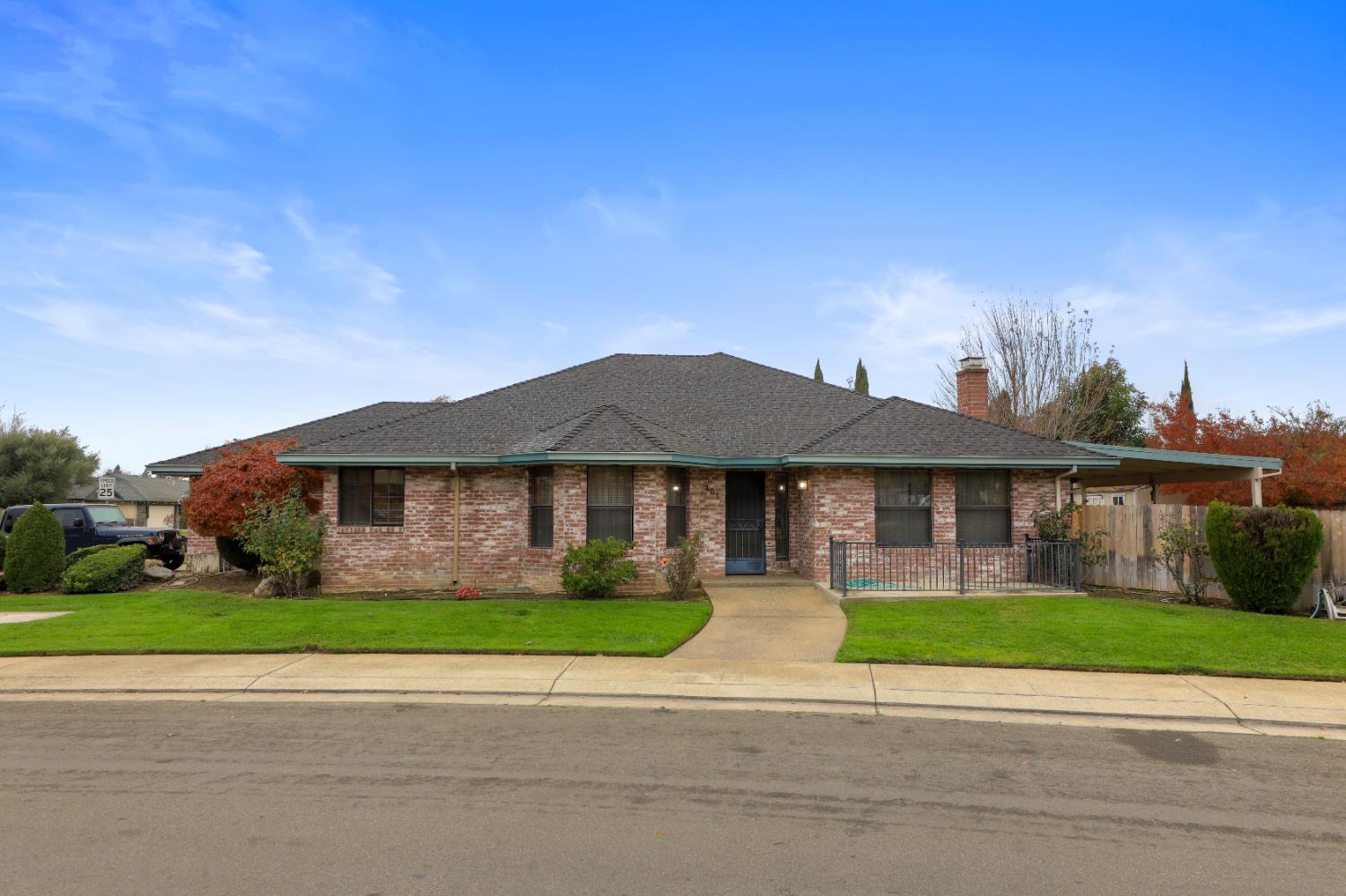 a front view of a house with a garden