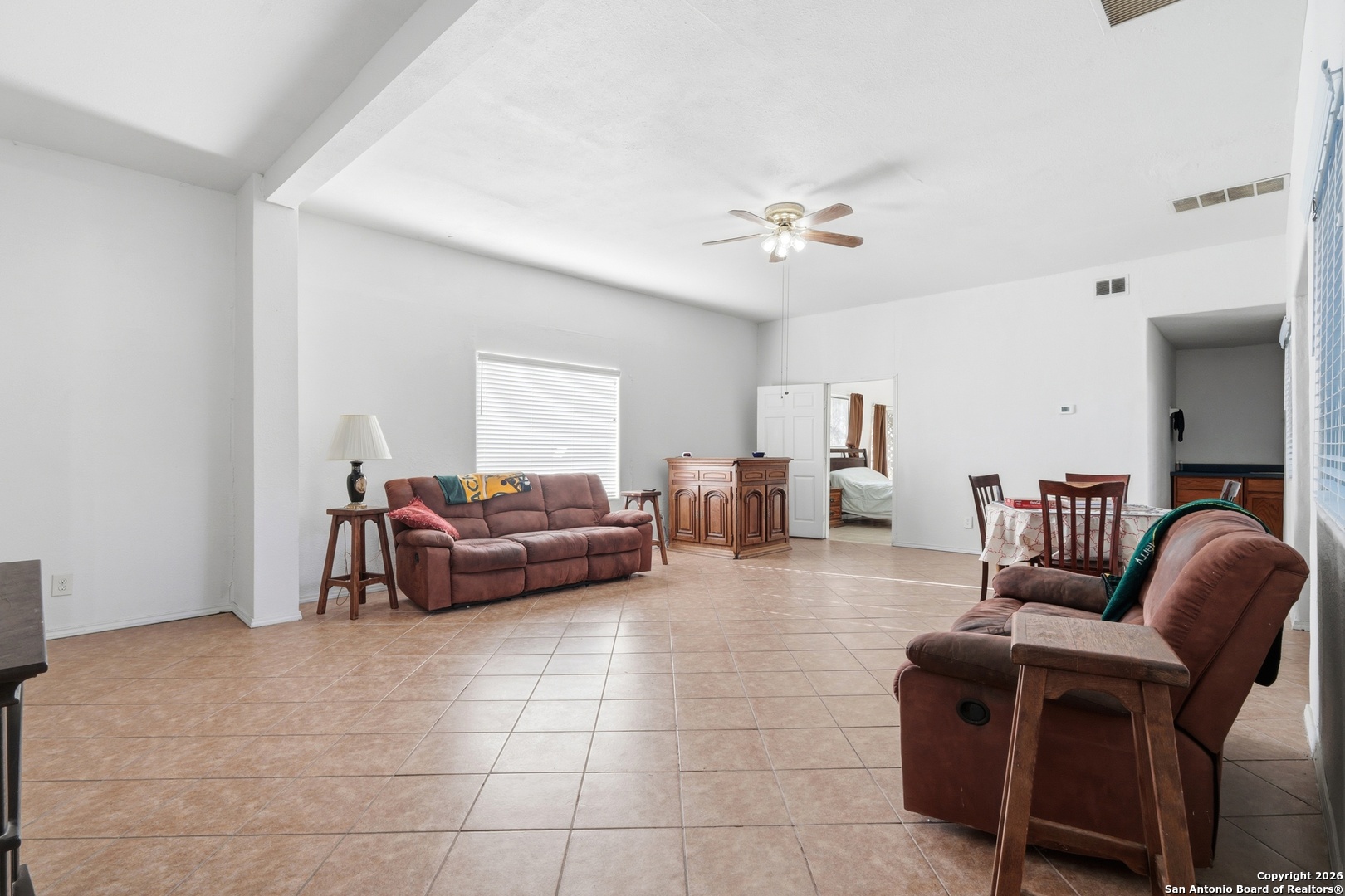 483 Sassman Road Marion, TX 78124 - Photo 11 of 39 a living room with furniture and a chandelier