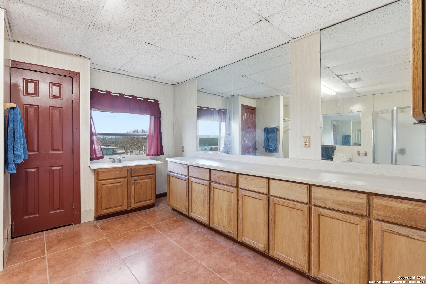 483 Sassman Road Marion, TX 78124 - Photo 26 of 39 a spacious bathroom with a granite countertop sink mirror and bathtub