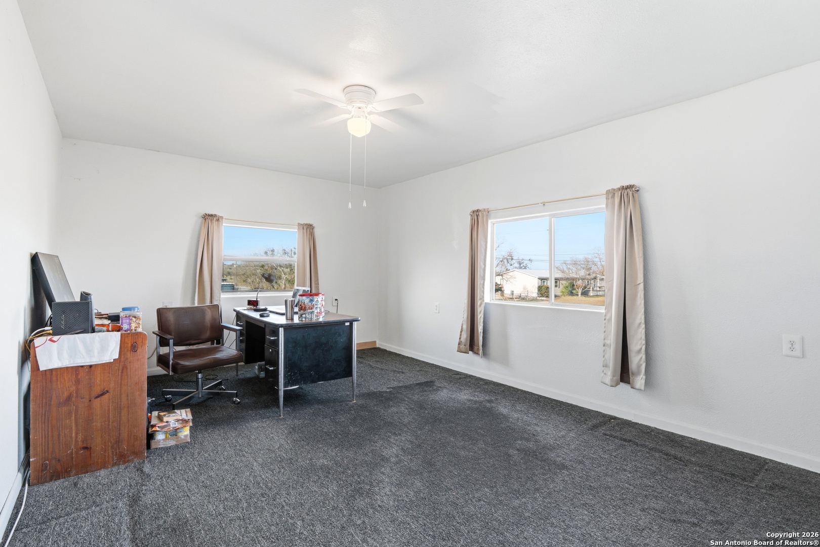 483 Sassman Road Marion, TX 78124 - Photo 29 of 39 a view of a workspace with furniture and a window