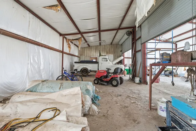 a view of parking garage with cars