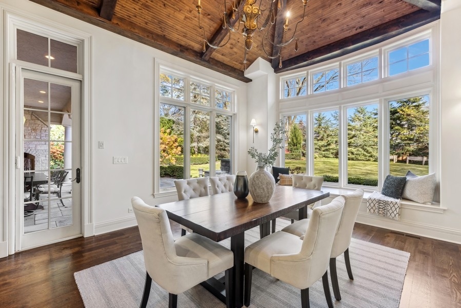 927 Cleveland Road Hinsdale, IL 60521 - Photo 14 of 46 a view of a dining room with furniture window and wooden floor