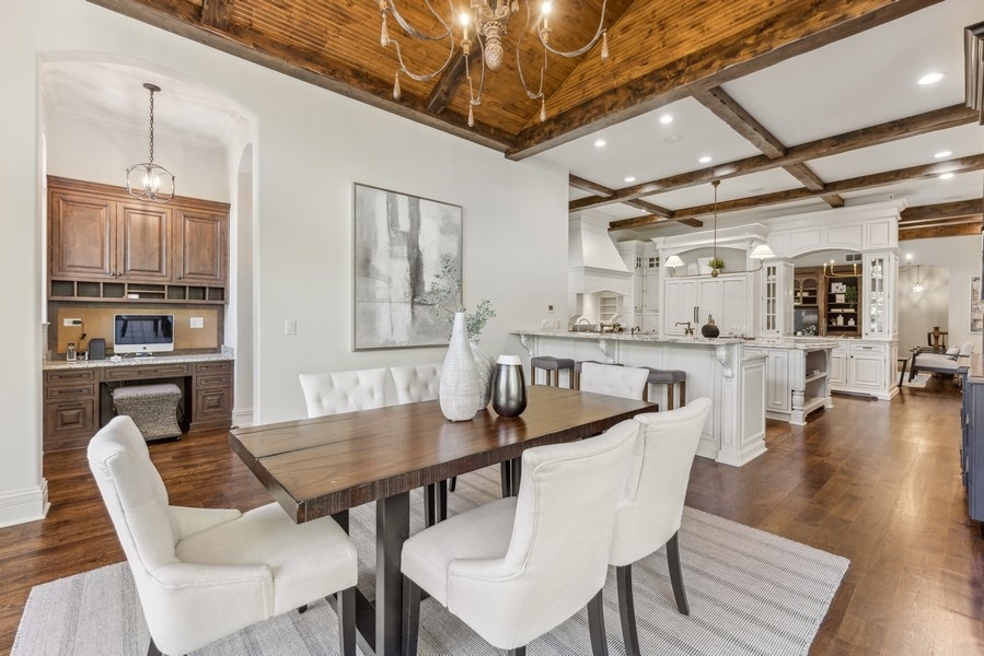 927 Cleveland Road Hinsdale, IL 60521 - Photo 20 of 46 a dining room with furniture and wooden floor