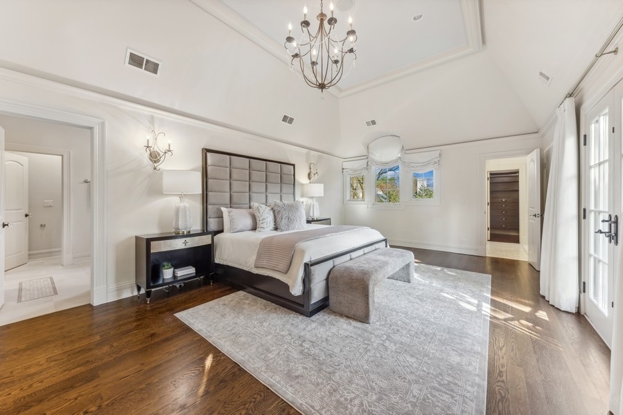 927 Cleveland Road Hinsdale, IL 60521 - Photo 23 of 46 a bedroom with a bed chandelier and a window