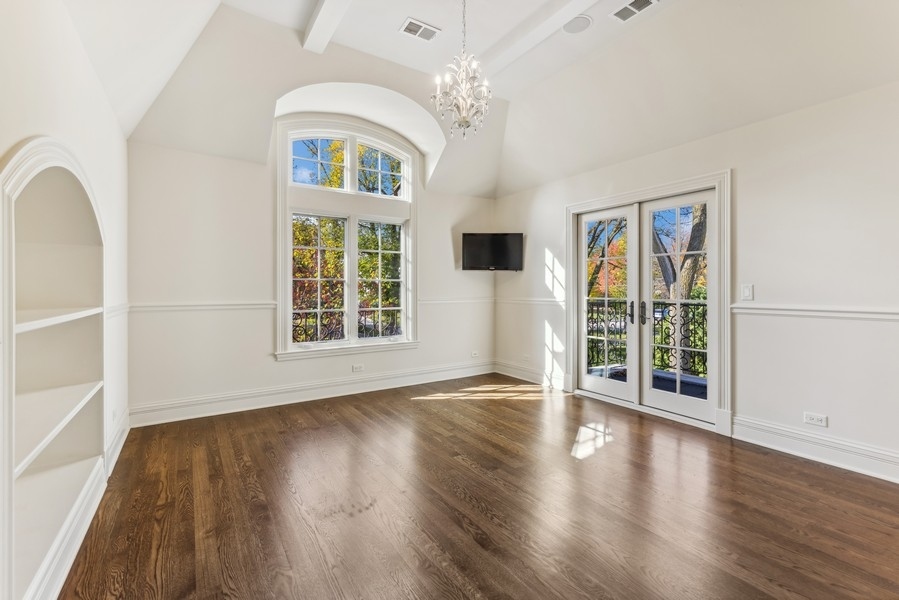 927 Cleveland Road Hinsdale, IL 60521 - Photo 27 of 46 a view of an empty room with wooden floor and a window