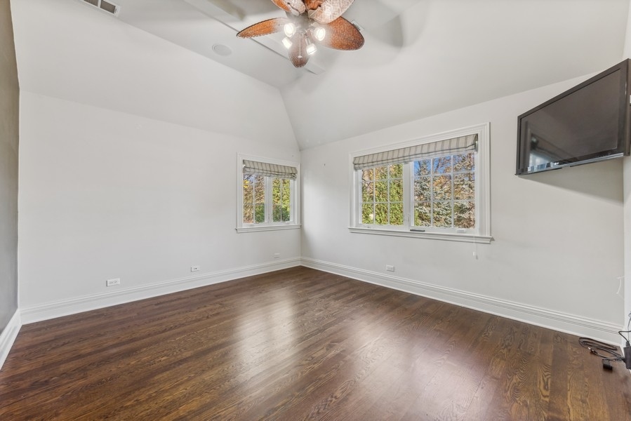 927 Cleveland Road Hinsdale, IL 60521 - Photo 31 of 46 a view of an empty room with wooden floor and a window