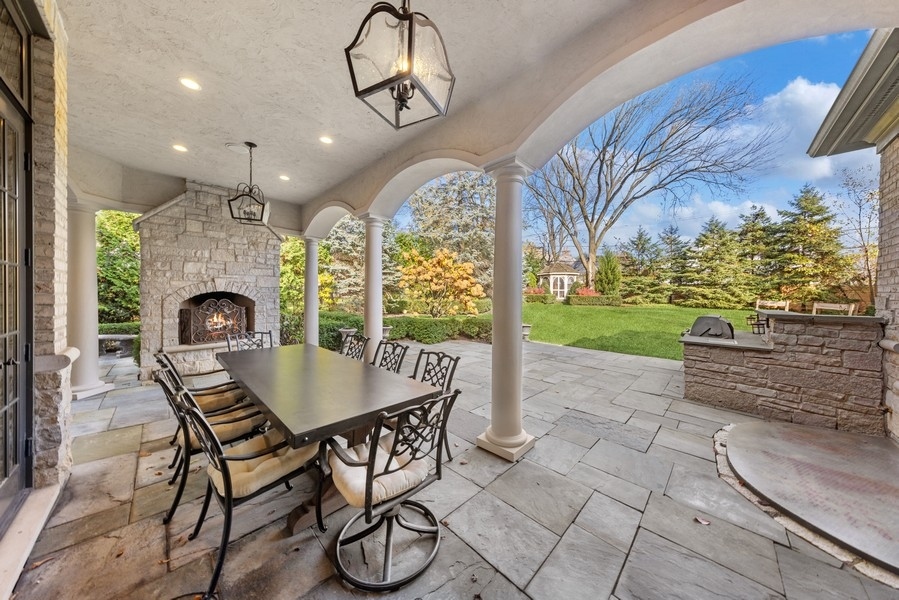 927 Cleveland Road Hinsdale, IL 60521 - Photo 37 of 46 a view of a dining room with furniture wooden floor and chandelier