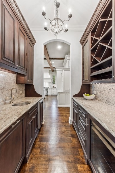 927 Cleveland Road Hinsdale, IL 60521 - Photo 6 of 46 a kitchen with stainless steel appliances granite countertop a stove a sink and a microwave