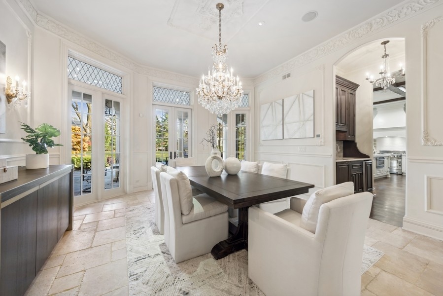 927 Cleveland Road Hinsdale, IL 60521 - Photo 7 of 46 a view of a dining room with furniture and a chandelier