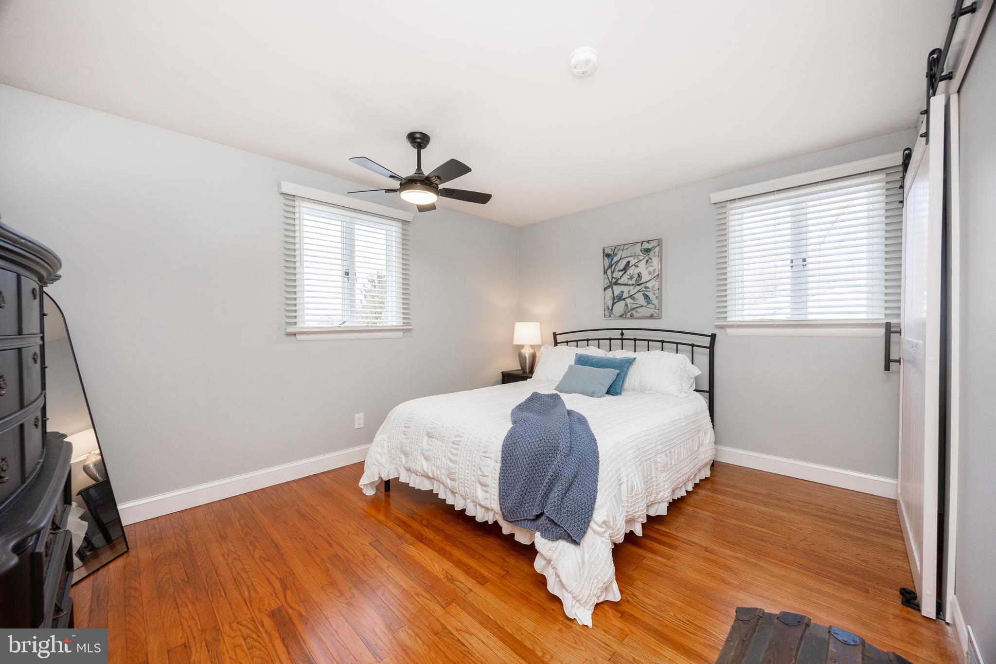 305 Concord Avenue Exton, PA 19341 - Photo 15 of 38 a bedroom with a bed and wooden floor