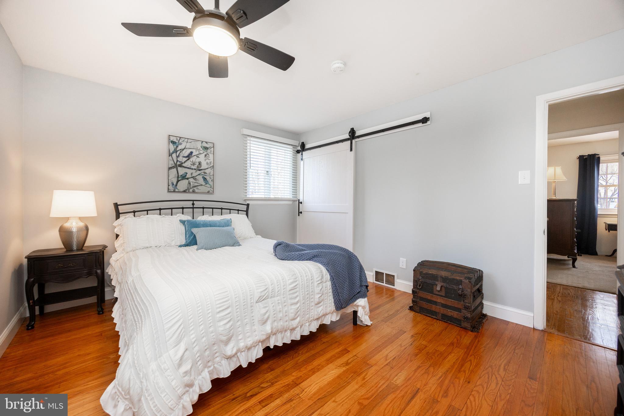 305 Concord Avenue Exton, PA 19341 - Photo 16 of 38 a bedroom with bed and a chandelier