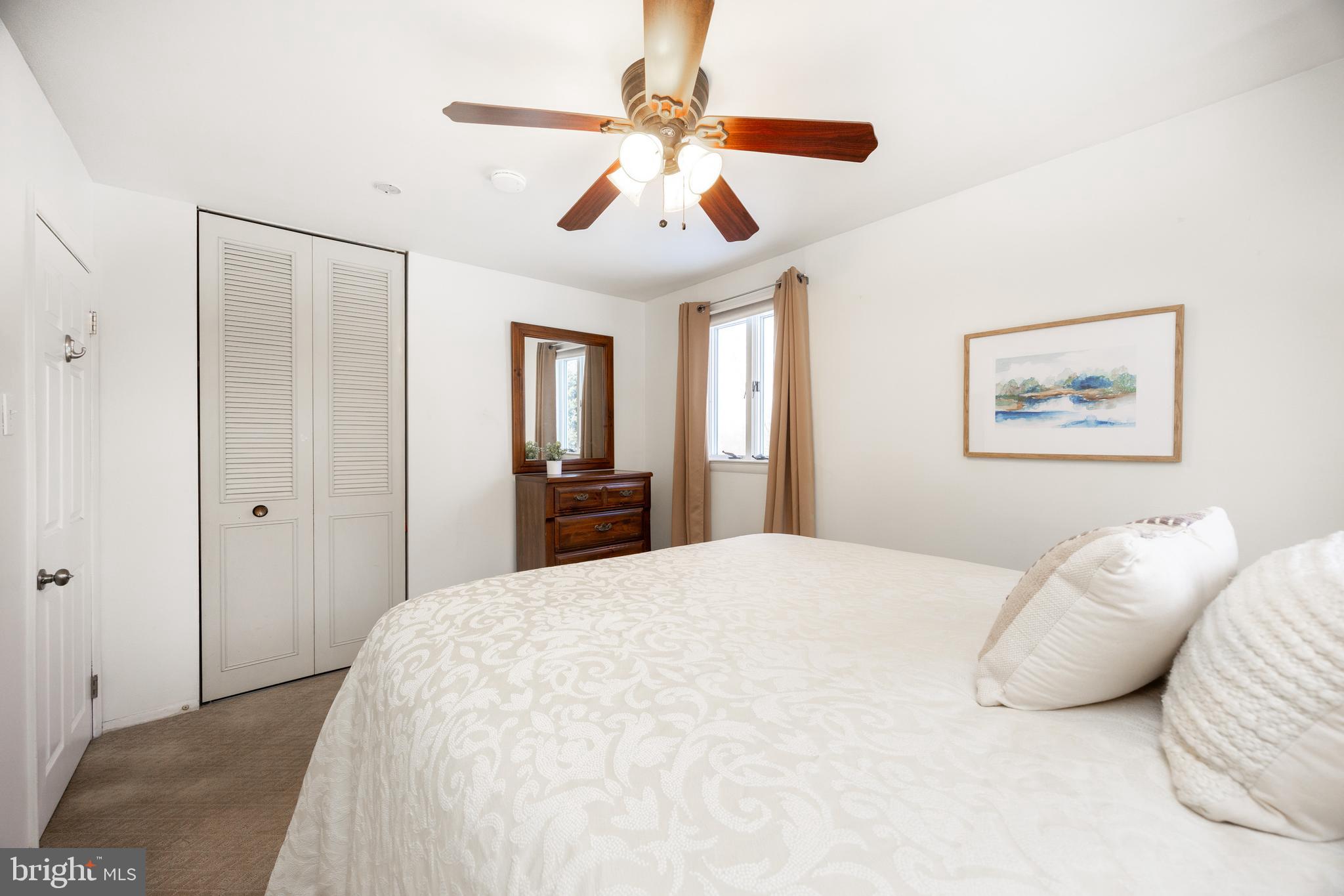 305 Concord Avenue Exton, PA 19341 - Photo 18 of 38 a bedroom with a large bed and a chandelier