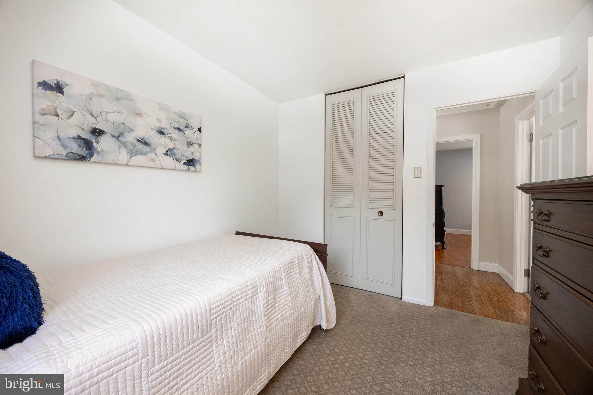 305 Concord Avenue Exton, PA 19341 - Photo 20 of 38 a bedroom with a bed and wall painting