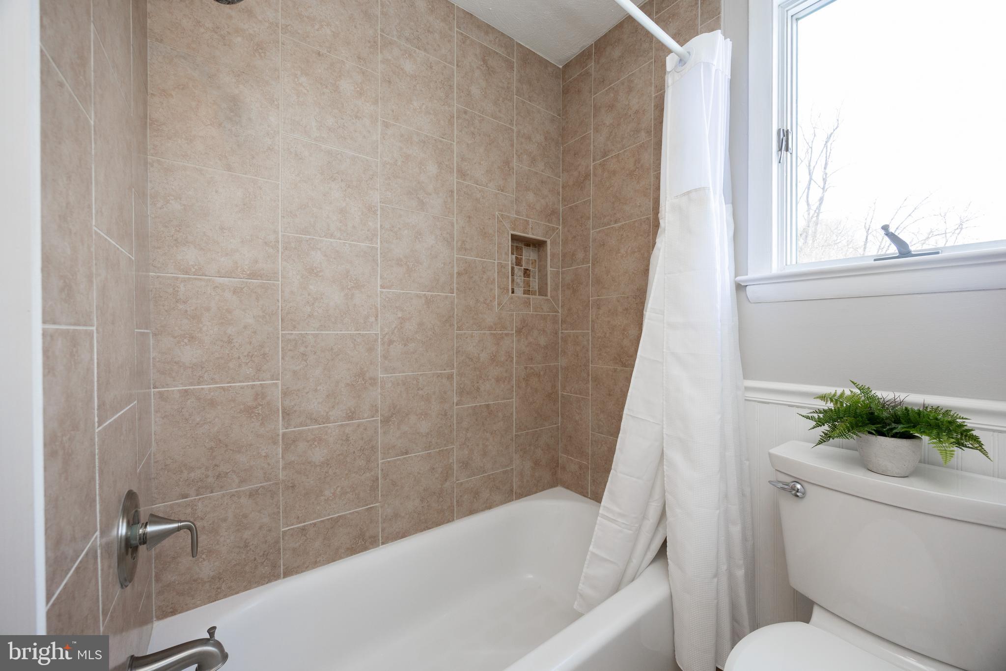 305 Concord Avenue Exton, PA 19341 - Photo 22 of 38 a bath tub sitting next to a white toilet